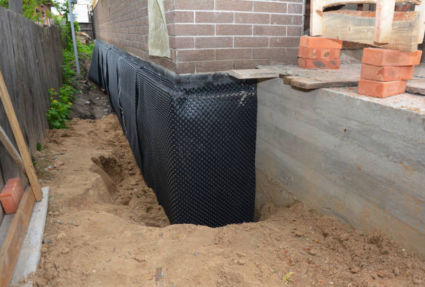 Happy homeowners after waterproofing job in Aston